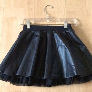 Black faux leather mini skirt with tulle trim